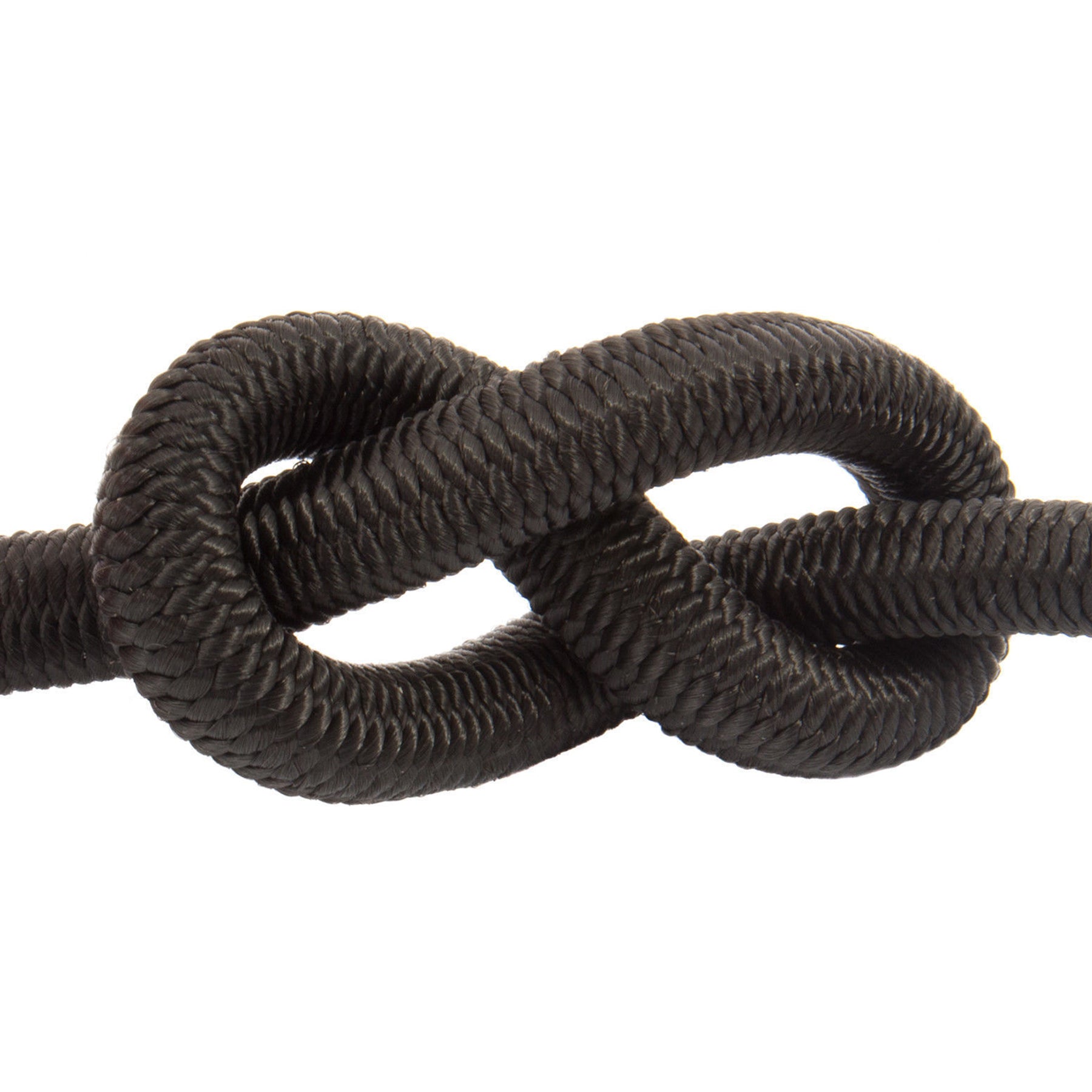 A knotted piece of cord rope in black very close up to show off its strength and durability