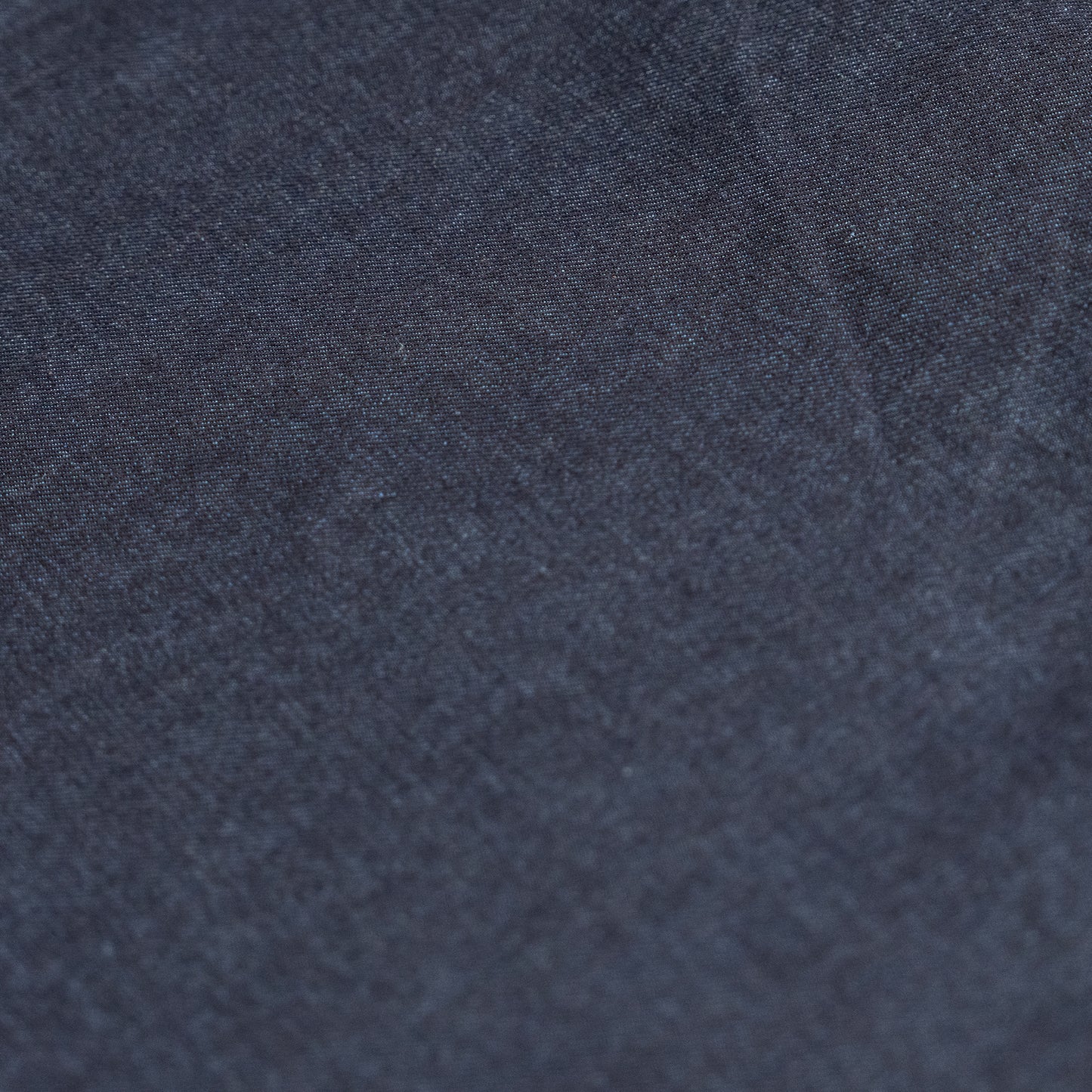 Close-up texture of indigo stretch denim jean fabric available at Brunswick Mills, ideal for sturdy garments like jeans and dungarees.