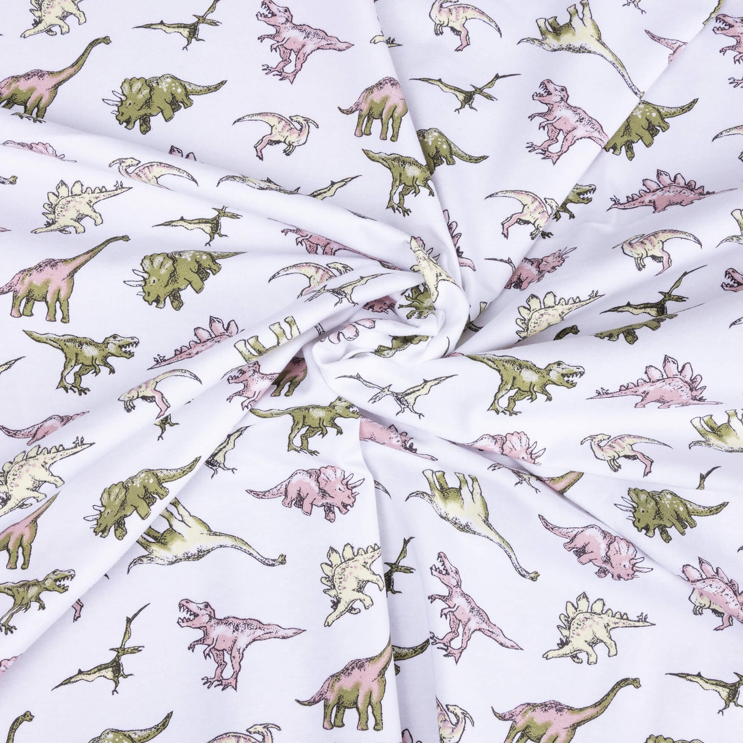 A swirl of the white dinosaur stretch jersey fabric with different dinosaurs on in pale greens, pinks and yellows.
