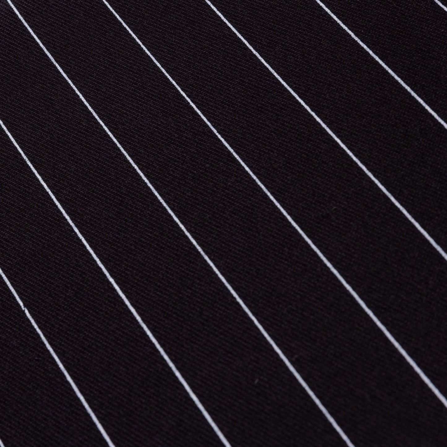 A close up of the black and white pin stripe fabric
