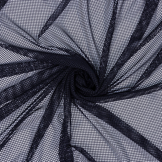 Stretchy Black fishnet fabric twisted round you can see the white background underneath.