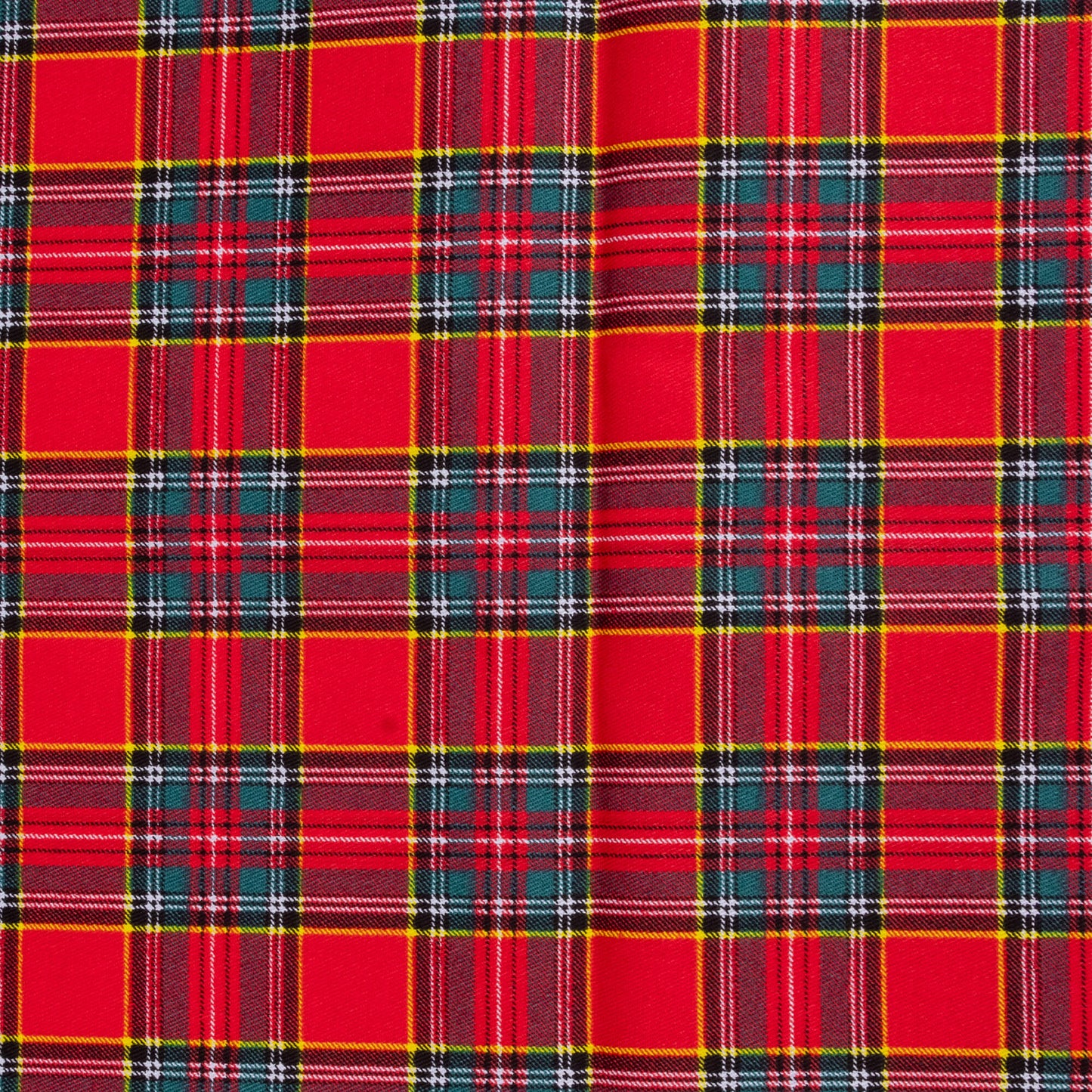 A close up of Red tartan fabric showing yellow, white, green and navy against a red background
