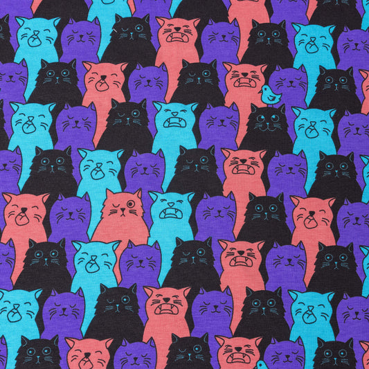 A stretch jersey fabric featuring cats that look like they are winking, singing or have their eyes shut, their is a bird one one of their heads. They are purple, black, pink and bright blue.