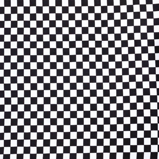 wide view of black and white checkerboard check fabric for crafting projects and dressmaking