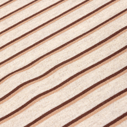 A close up of Ecru, brown and beige striped  soft t-shirt material in a jersey fabric for making clothing or crafting projects.