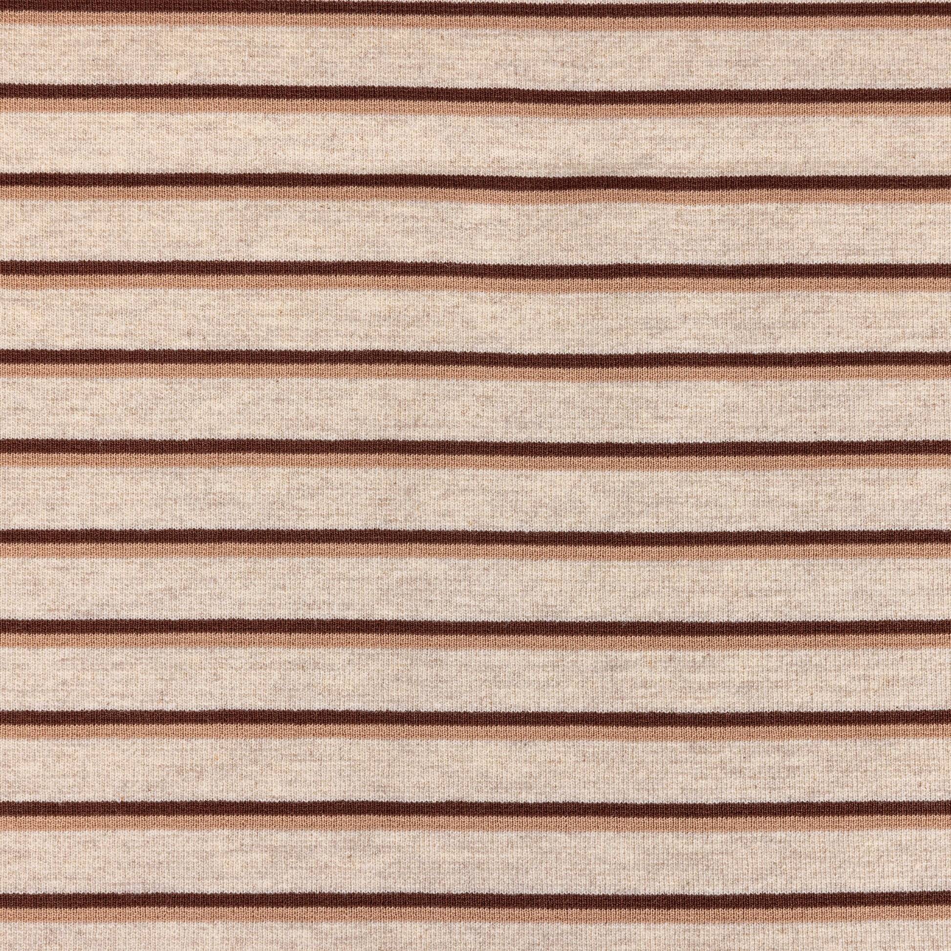 A horizontal view of Ecru, brown and beige striped soft t-shirt material in a jersey fabric for making clothing or crafting projects.
