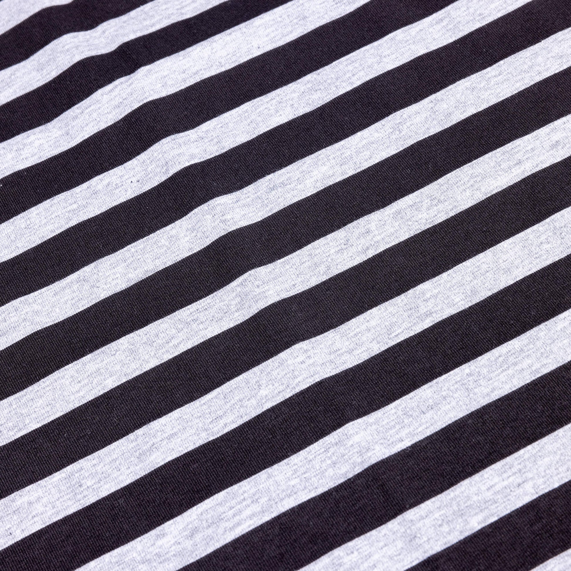 horizontal view of a black and grey striped light t- shirt fabric 