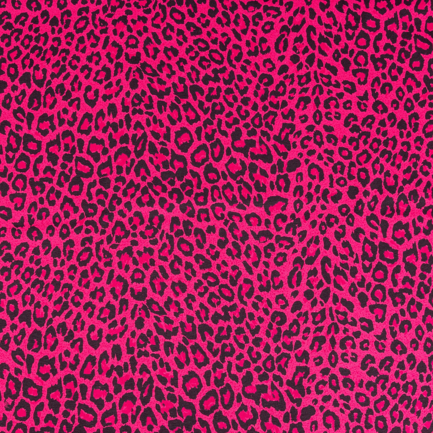 A wide of bright pink and black leopard print fabric in a soft jersey t-shirt weight perfect for crafting