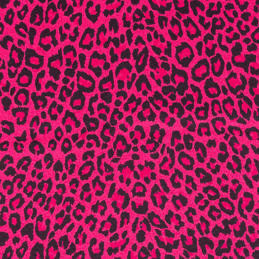 A close up of bright pink and black leopard print fabric in a soft jersey t-shirt weight perfect for crafting