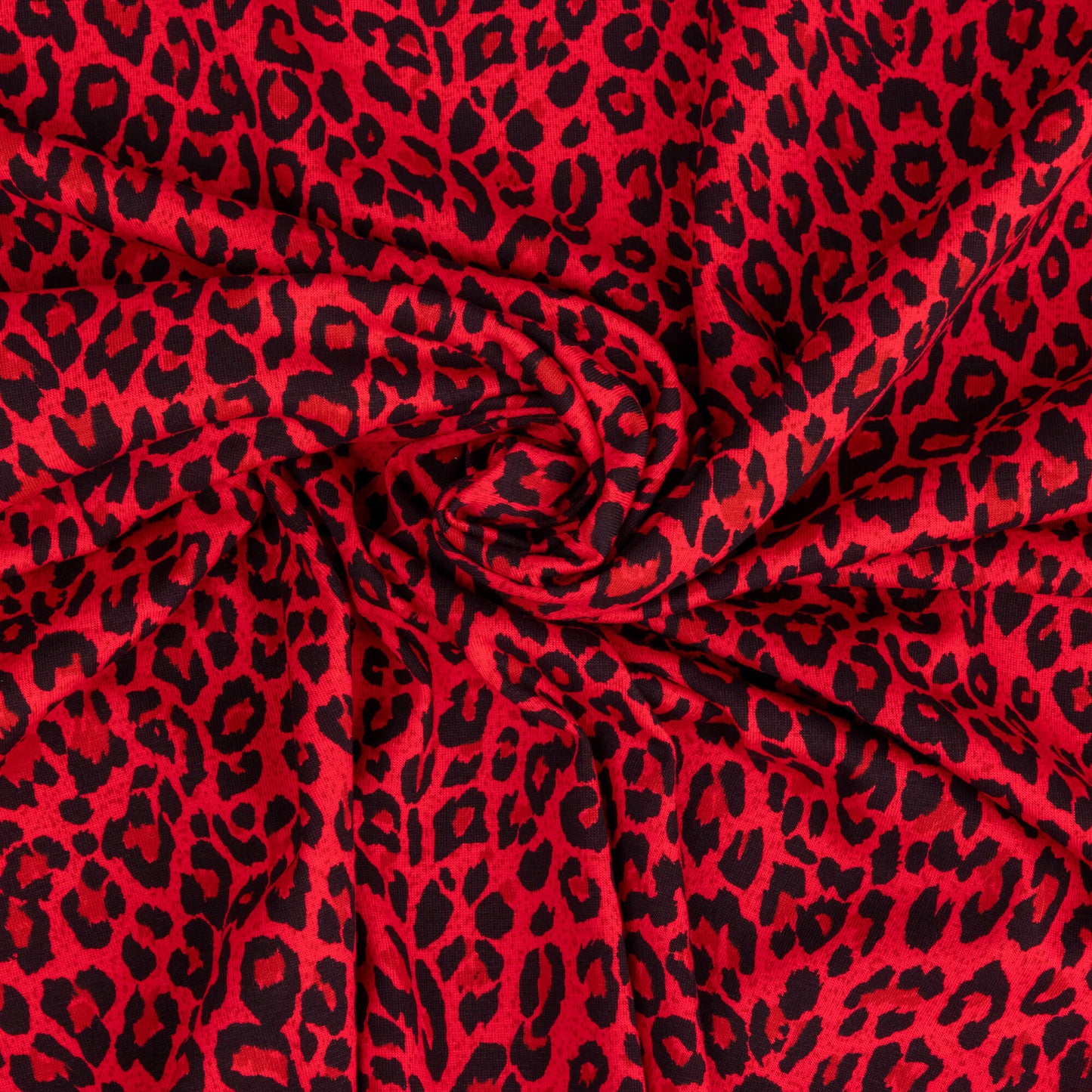 A swirl of bright red and black leopard print fabric in a soft jersey t-shirt weight perfect for crafting