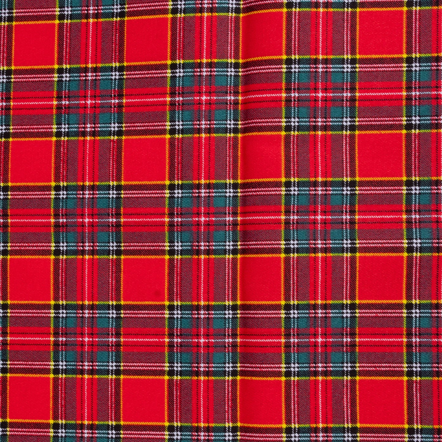 A close up of Red tartan fabric  showing yellow, white, green and navy against a red background